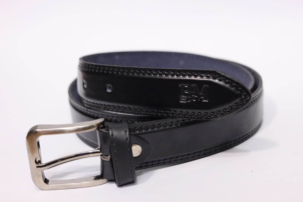 Black leather belt with silver buckle on a white background