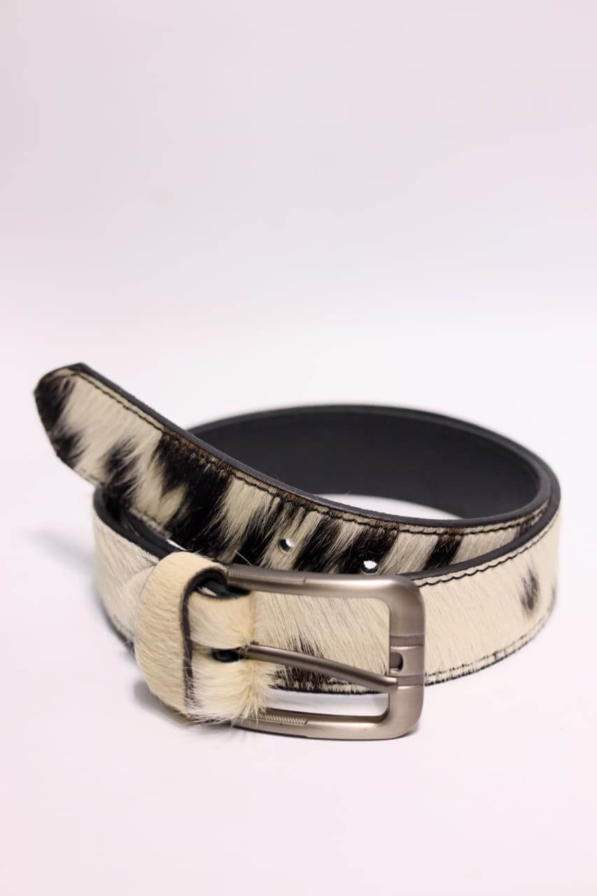 Zebra print belt with a silver buckle on a white background