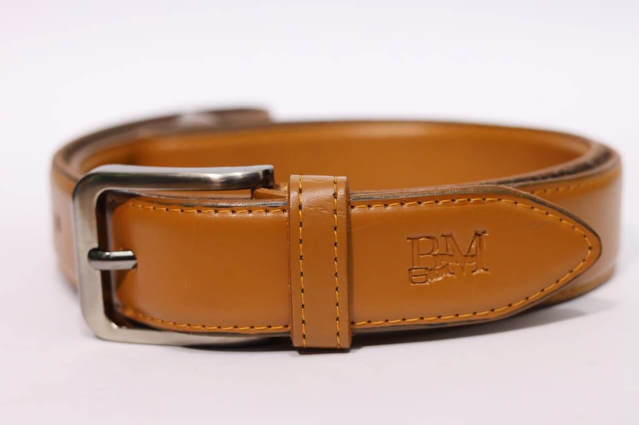Brown leather belt with silver buckle on a white background