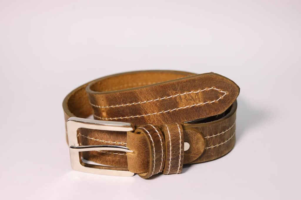 Brown leather belt with a silver buckle on a light gray background