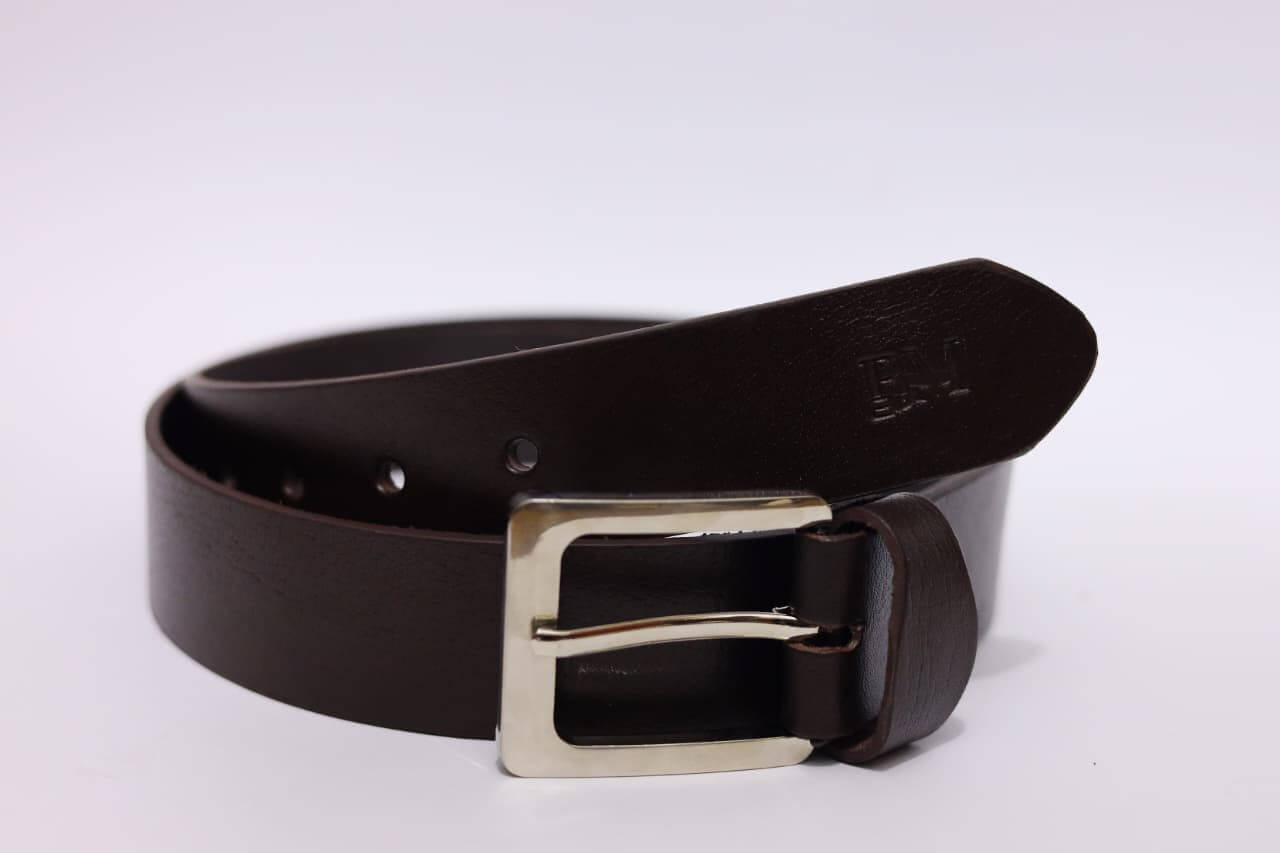 Brown leather belt with a silver buckle on a white background