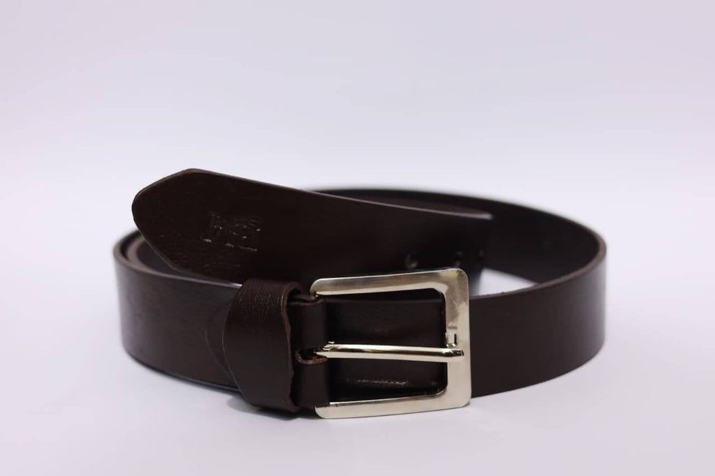 Brown leather belt with a silver buckle on a white background